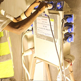 temporary electrical distribution panel on a construction site with unauthorised additional outlet installed